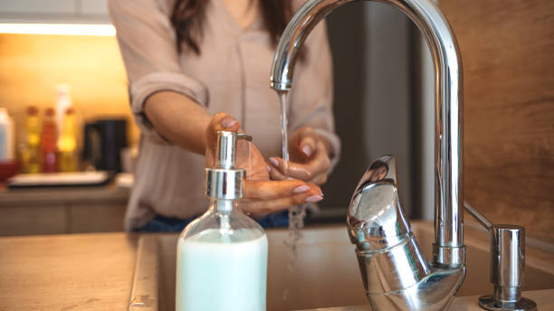 istock Woman washing her hands with soap. 1212760746
