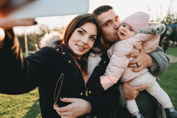 istock Family taking a selfie at the park 1212764701
