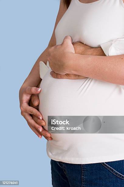 Expecting Mother With Father Hands Stock Photo - Download Image Now - Adult, Anticipation, Beginnings