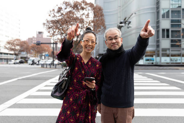 istock 2 people crossing street 1212766482