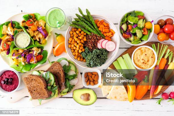 Healthy Lunch Table Scene With Nutritious Lettuce Wraps Buddha Bowl Vegetables Sandwiches And Salad Overhead View Over White Wood Stock Photo - Download Image Now