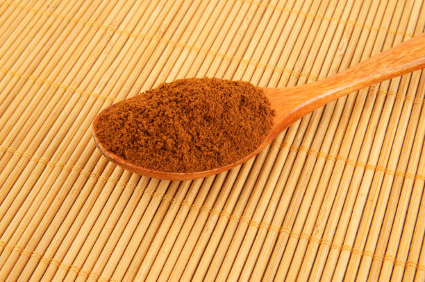 istock Spoon with instant coffee on bamboo placemat 1212771397