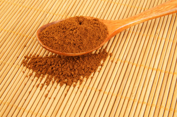 istock Spoon with instant coffee on bamboo placemat 1212771517