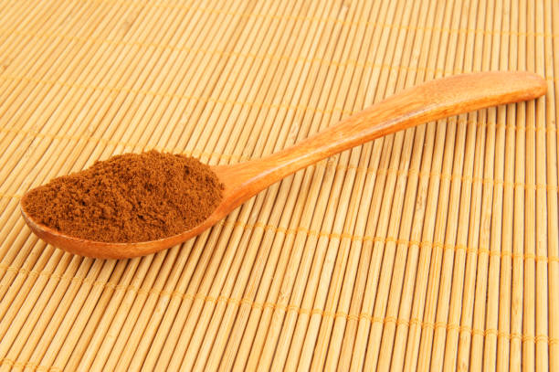 istock Spoon with instant coffee on bamboo placemat 1212771607
