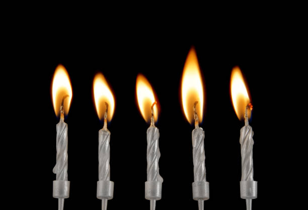 istock Silver birthday candles on black 1212771700