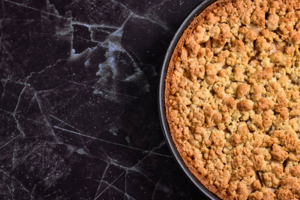 A fresh baked homemade apple pie on the old wooden table