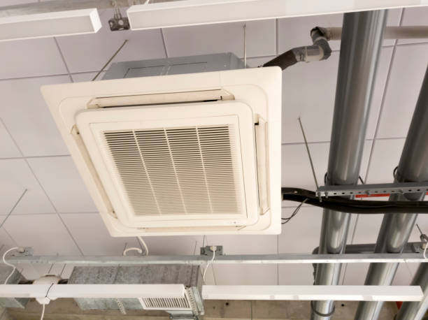istock Installing air ducts on a high building. Air conditioner system. 1212773799