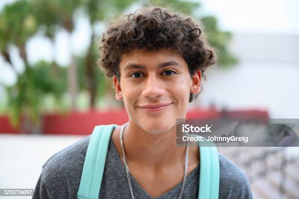 Portrait Of Contented Male Hispanic Teenager Stock Photo - Download Image Now - Teenager, Latin American and Hispanic Ethnicity, Portrait