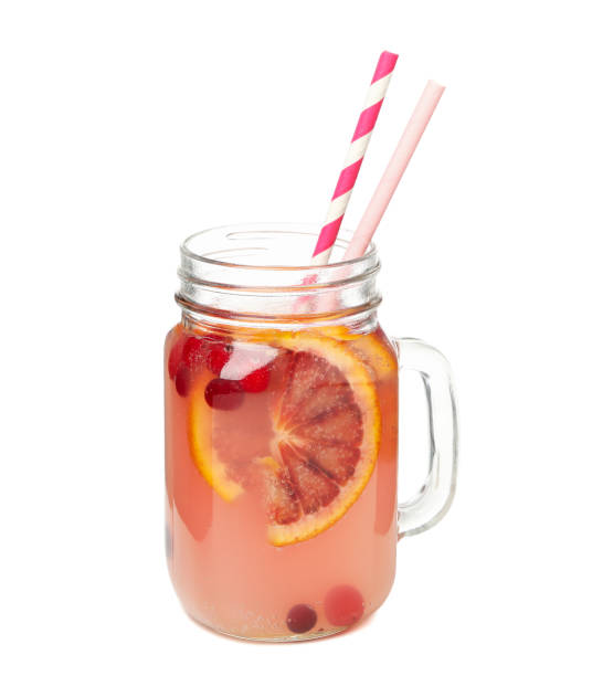 istock Glass jar of lemonade isolated on white background 1212776123