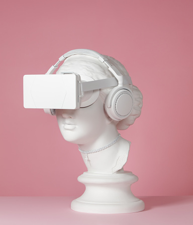 Plaster head model (mass produced replica of Head of Aphrodite of Knidos) with headphones and virtual reality headset