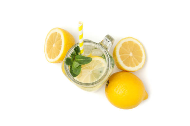 istock Glass jar with lemonade and lemons isolated on white background 1212779963