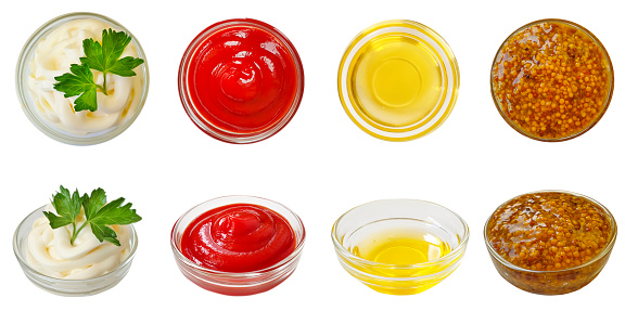 mustard, ketchup, mayonnaise, oil isolated on a white background