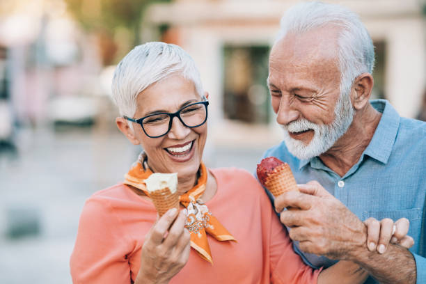 istock Happy senior couple eating ice cream 1212782128