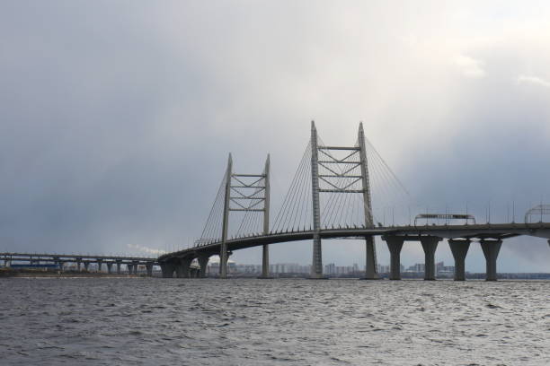 istock Seascape on a sunny evening with a large bridge 1212783449