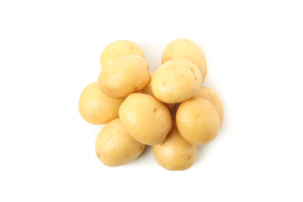 istock Heap of young potato isolated on white background 1212784031
