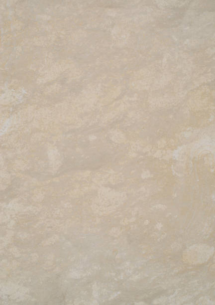 istock Ecru sandstone on wall closeup in sunny day 1212785790