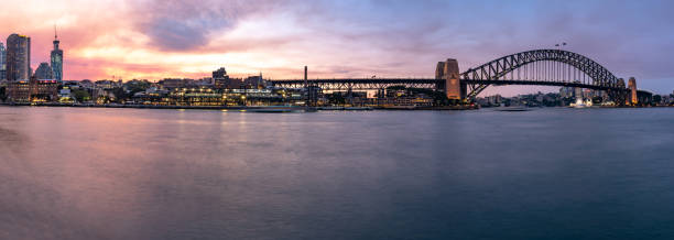 istock East Circular Quay panoramic, Downtown district view at dusk in Sydney, Australia 1212786818