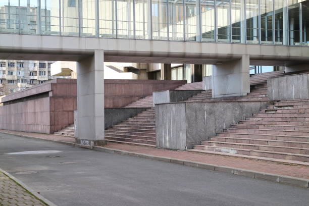 istock Glass passage and staircase of a modern building 1212787313