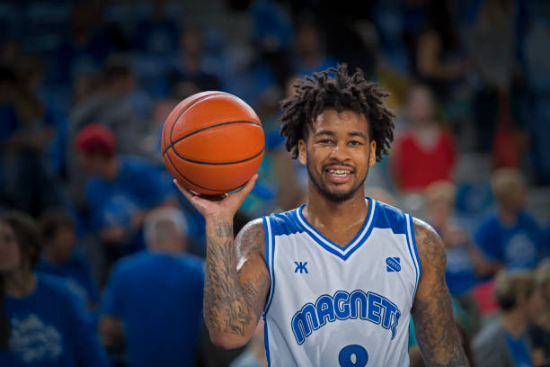 istock Basketball player holding ball 1212788838