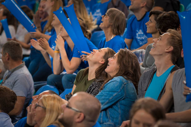 istock Cheerful spectators sitting in stand 1212788845