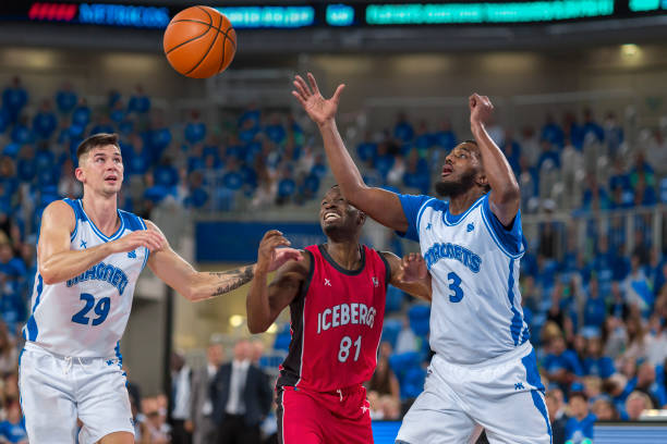 istock Basketball players chasing for ball 1212788860