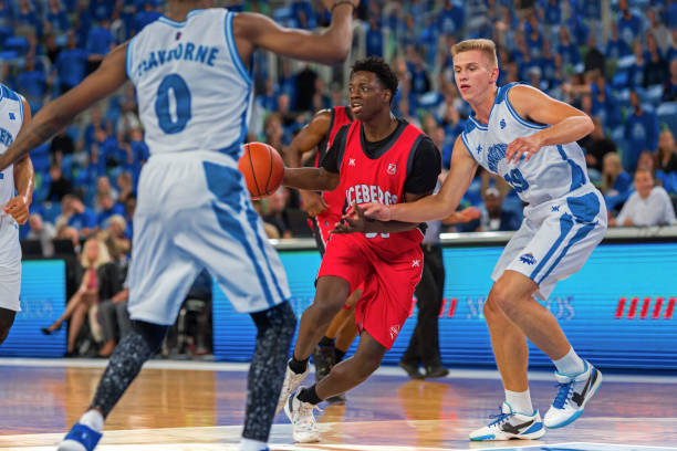 istock Basketball players chasing for ball 1212788871