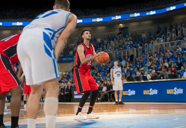 istock Basketball player taking penalty shot 1212788874