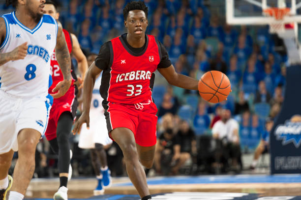 istock Basketball players chasing for ball 1212788879