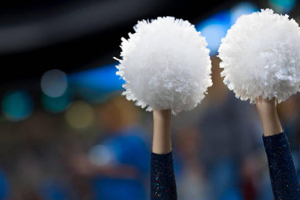 Close-up of pom pom Close-up of cheerleader's hands holding pom pom in Arena Stozice, Ljubljana, Slovenia. cheerleader photos stock pictures, royalty-free photos & images