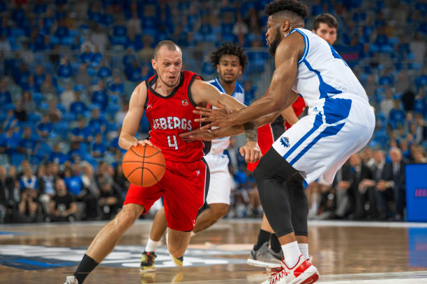 istock Basketball players chasing for ball 1212788892