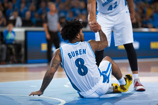 istock Player giving helping hand to his teammate 1212788919