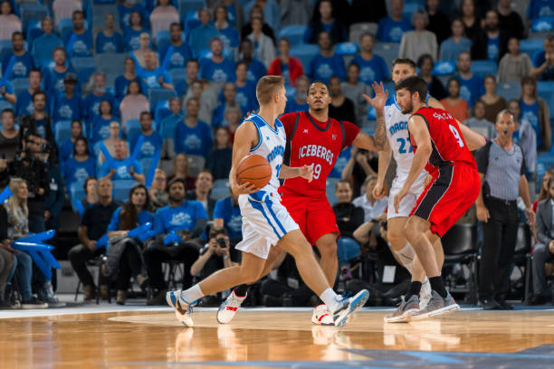 istock Basketball players chasing for ball 1212788922