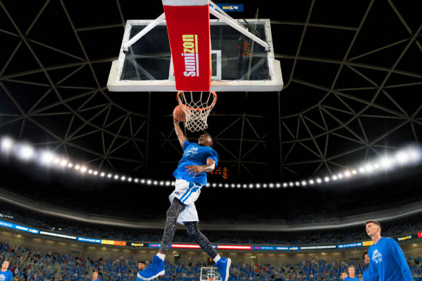 Basketball player slam dunking ball in Arena Stozice, Ljubljana, Slovenia.