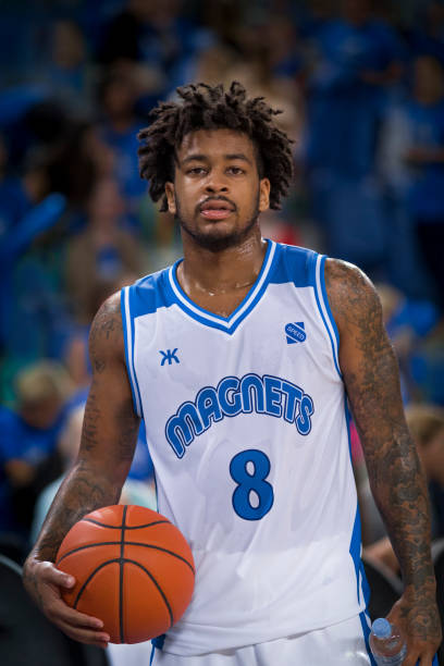 istock Basketball player holding ball 1212788928