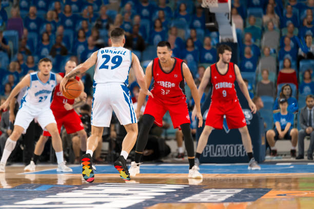 istock Basketball players chasing for ball 1212788929