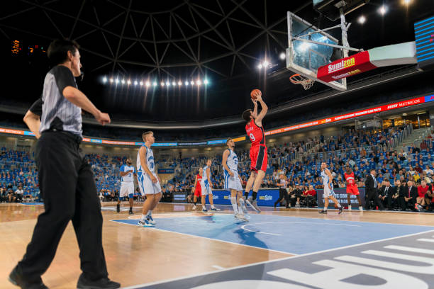 istock Basketball player aiming ball for hoop 1212788934