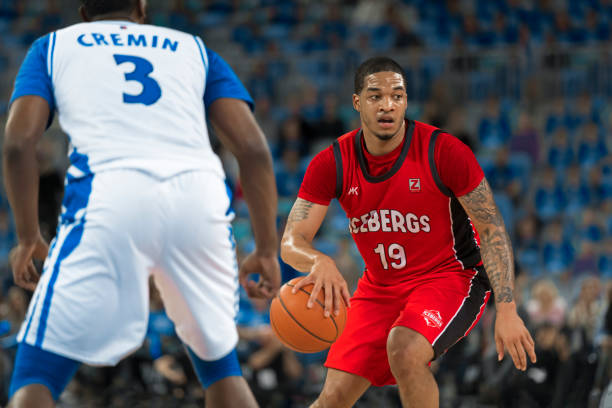 istock Basketball player dribbling ball 1212788936