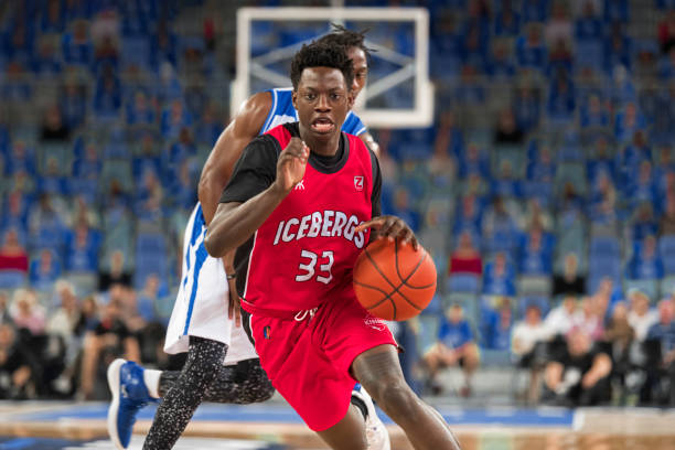 istock Basketball players playing on court 1212788939