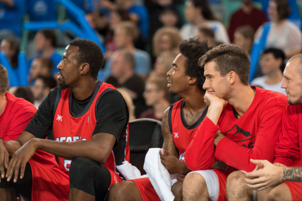 istock Basketball players watching match 1212788941