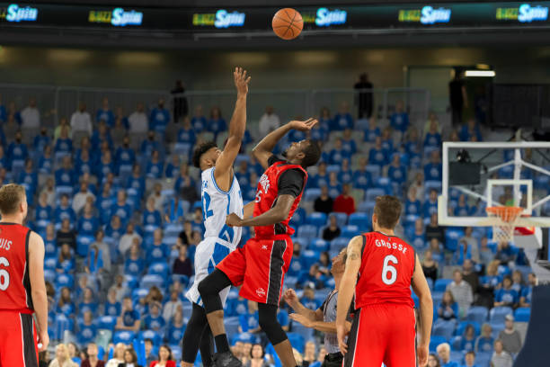 istock Basketball players chasing for ball 1212788953