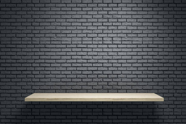 istock Empty wooden shelf on brick wall. 1212789928