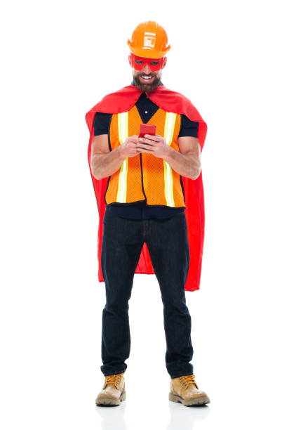 istock Young male manual worker repairing wearing boot and using mobile phone 1212790404