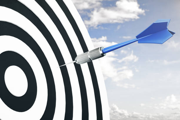 istock Darts arrow flying in target center 1212790435