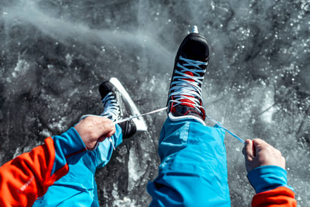 istock Lacing up the ice skates from a first person view 1212793494
