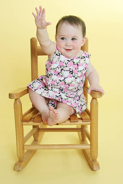istock happy baby raising hand 121279492