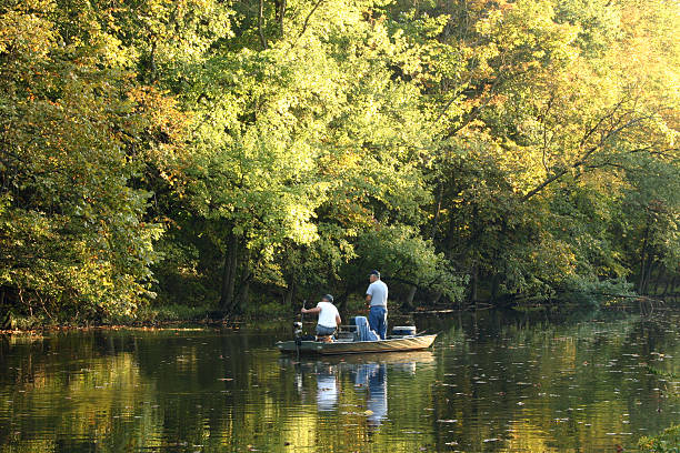 Silhouette of a man by the river
