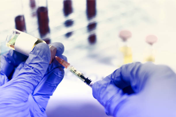 istock Hands with syringe and vial 1212797654