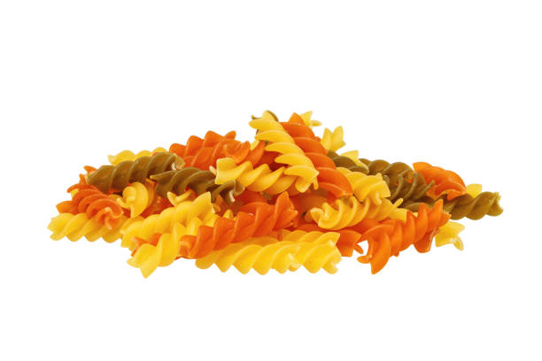 Tricolor fusilli pasta isolated on white background.