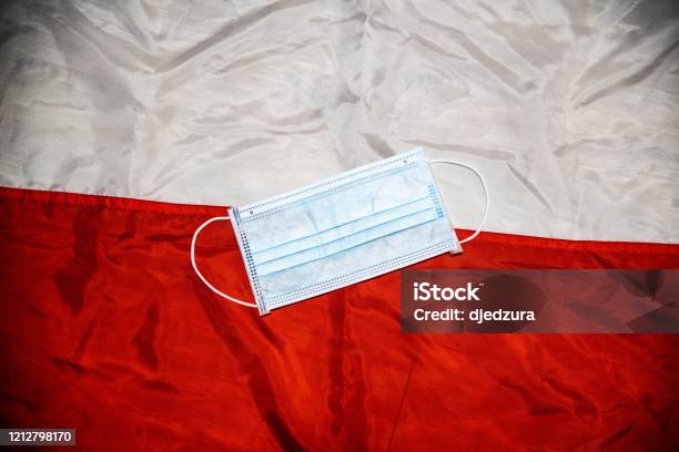 Medical Protective Mask On Polish Flag Stock Photo - Download Image Now - Poland, COVID-19, Cold And Flu