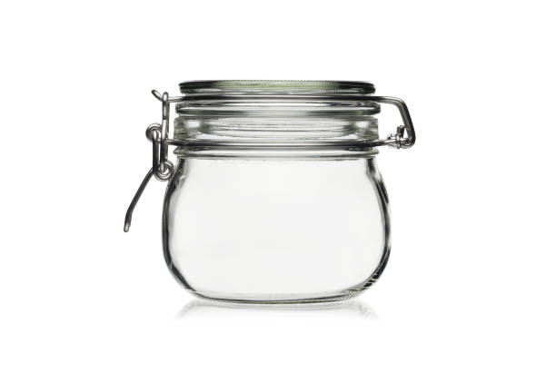 istock Empty glass jar for food storage isolated on a white background. 1212798358